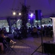 Elizabeth Acevedo reads to the audience under a large tent.